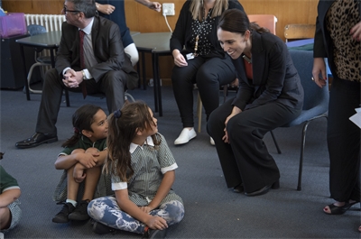 PM Jacinda Ardern talks to children